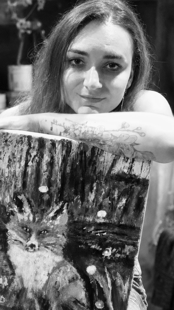 Christina Hoffman with one of her original fox paintings