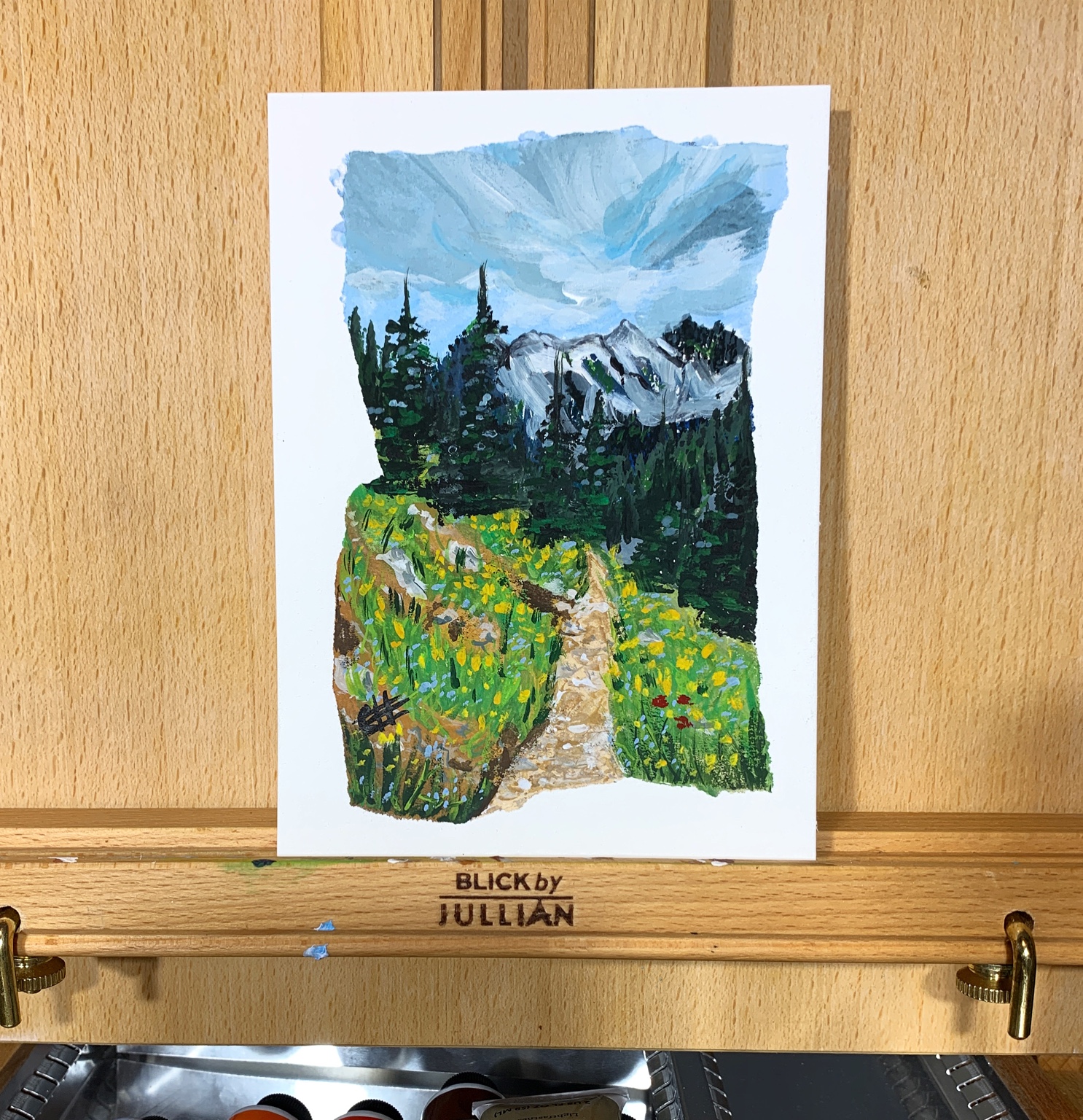 Painted mountain path through wildflowers